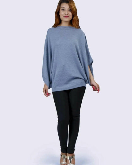 Cashmere Poncho | KCI 127 - Woman in blue sweater and black pants