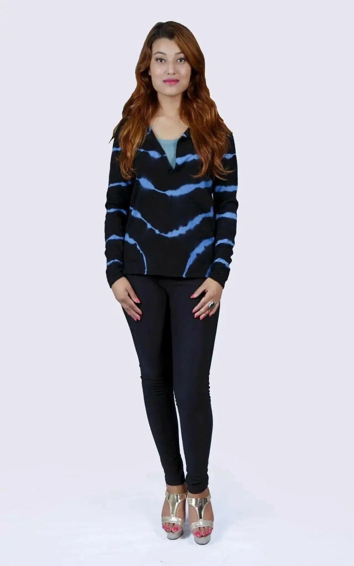 Woman wearing black sweater and jeans, showcasing Cashmere Sleeve Print Tunic Top