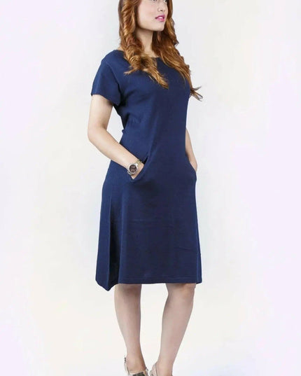 Woman in blue crew neck cashmere dress on white background