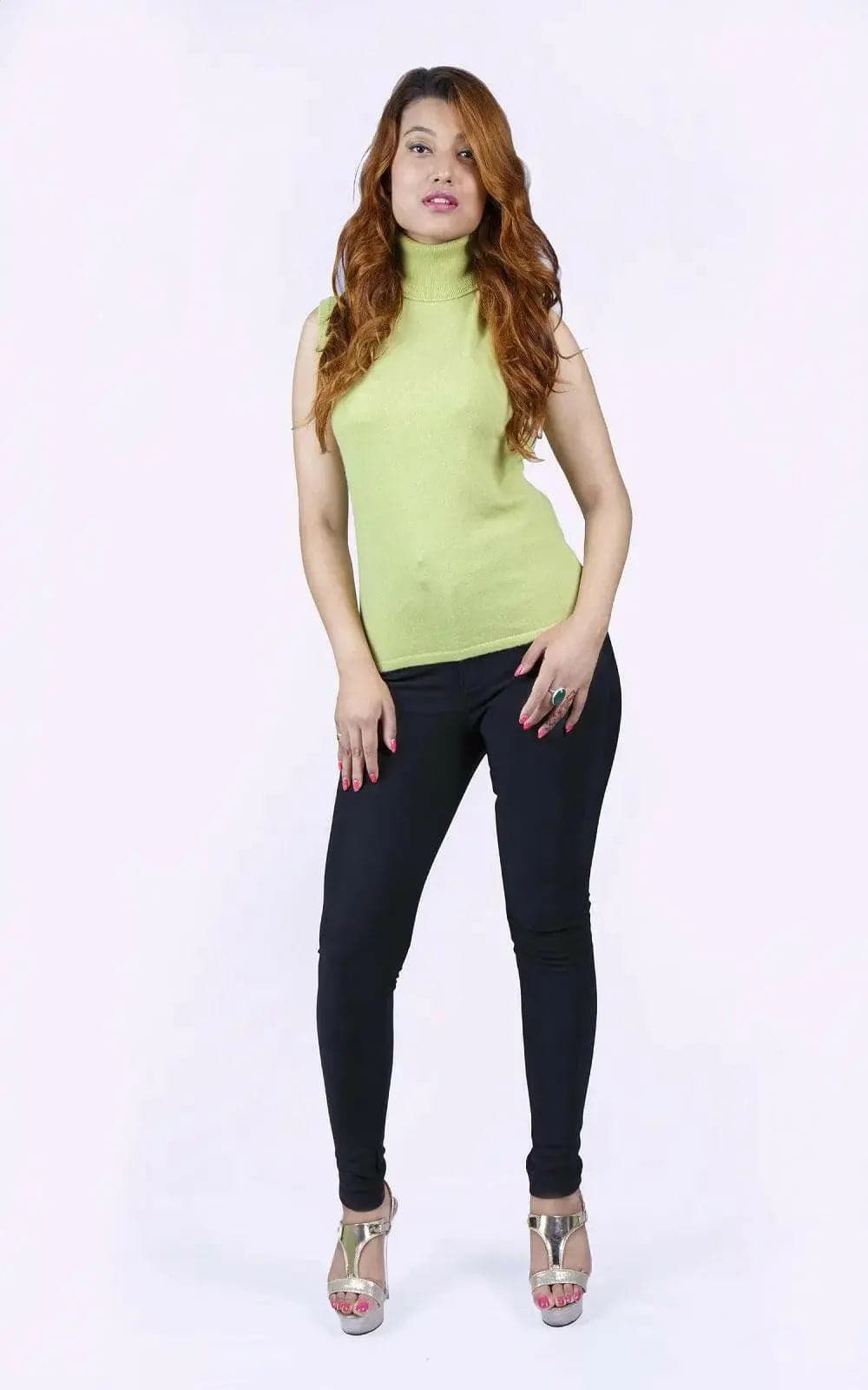 Stylish Italian cashmere sleeveless pullover on woman in lime top and black pants