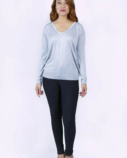 Woman in grey cropped sleeve jumper and black pants - KCI 226