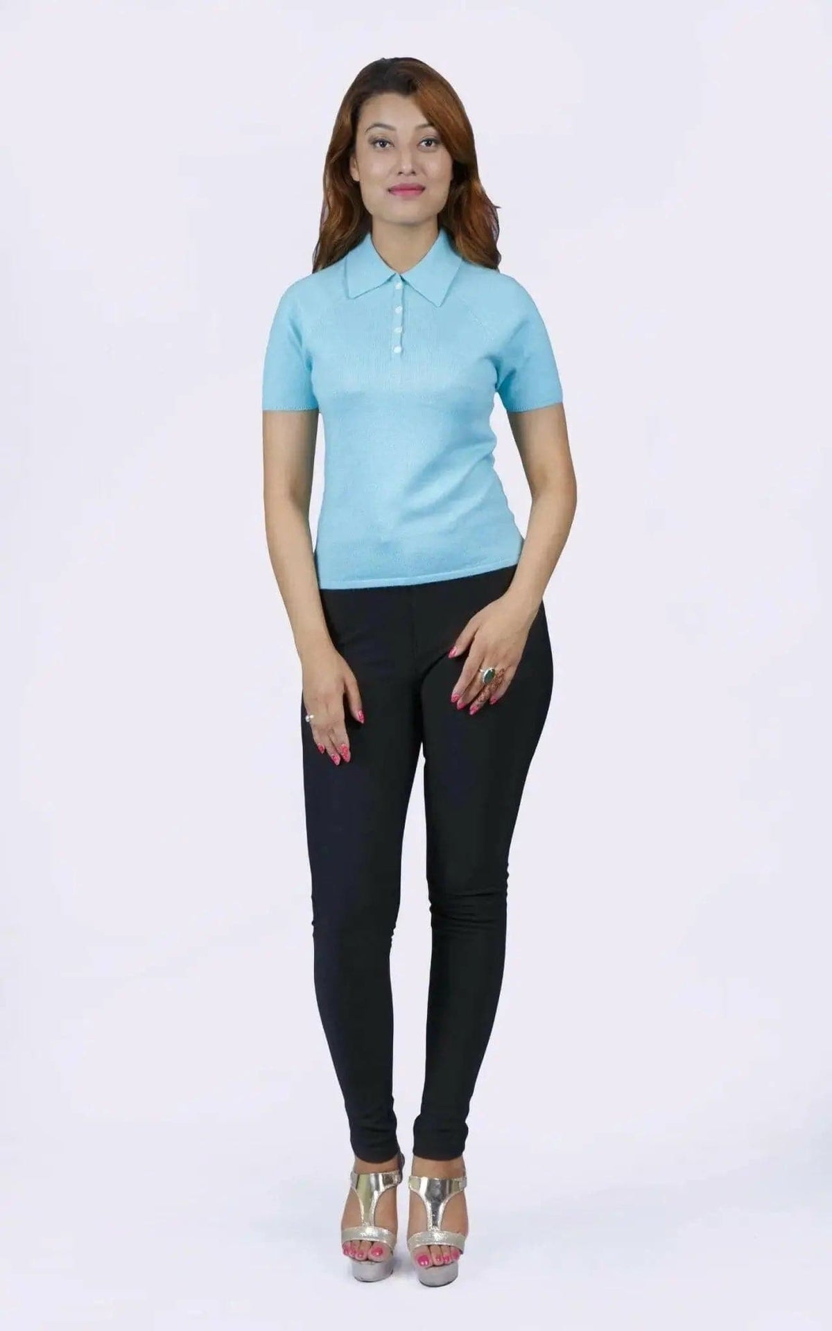 Woman in blue shirt and black pants, teal polo collar, KCI 232