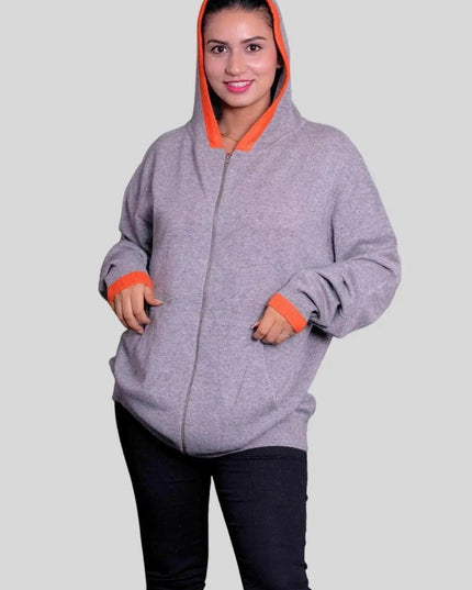Woman wearing grey and orange cashmere hooded sweater by KCI 293