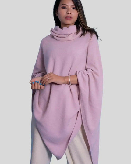 Luxurious Cashmere Turtle Neck Poncho - Woman in Pink Poncho with Hands on Hips