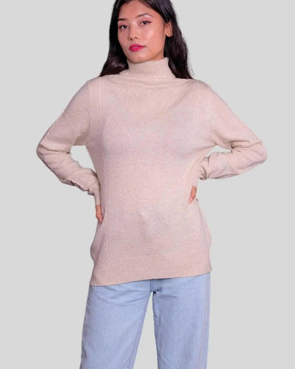 Woman wearing pink cashmere turtleneck pullover and blue jeans