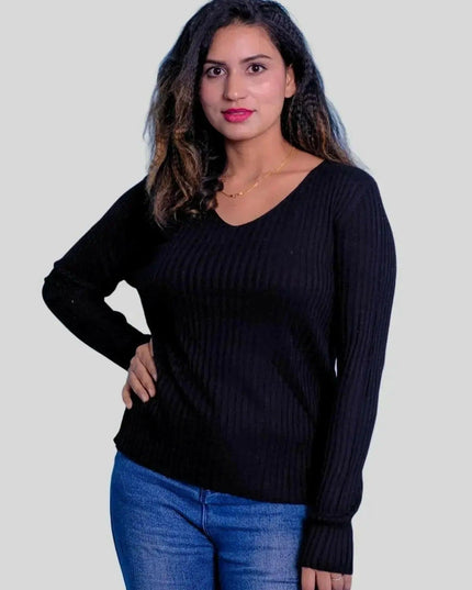 Stylish woman in jeans and black sweater wearing luxurious cashmere v neck pullover