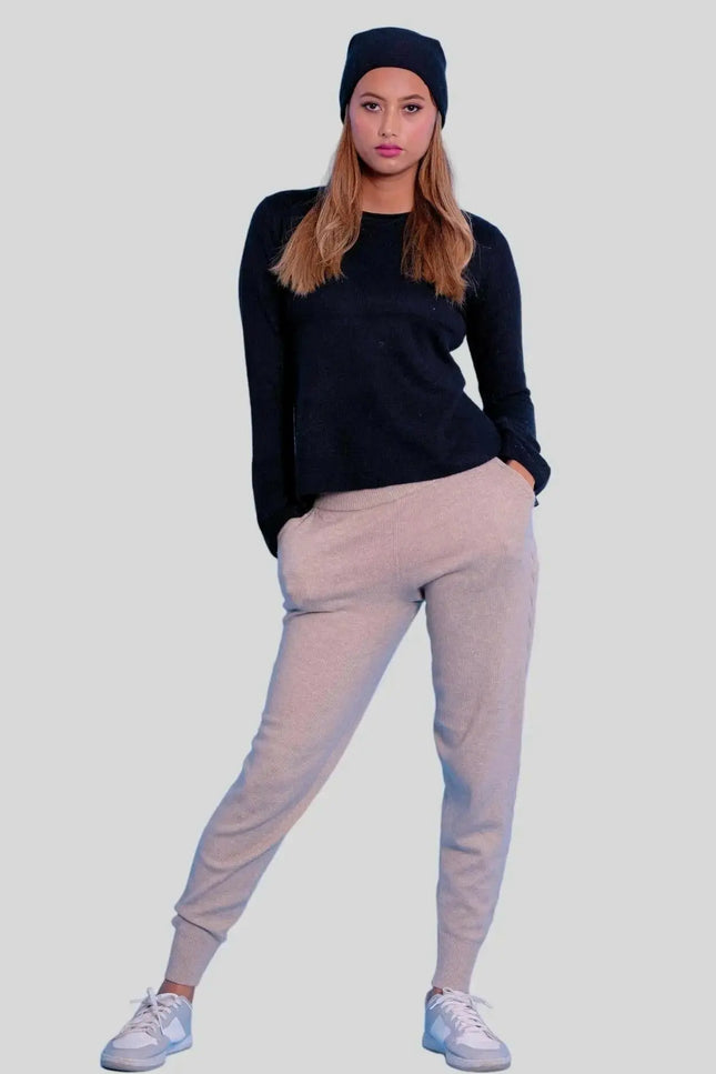Luxurious Italian Cashmere Cable Trouser: Woman in black sweater and grey sweat pants
