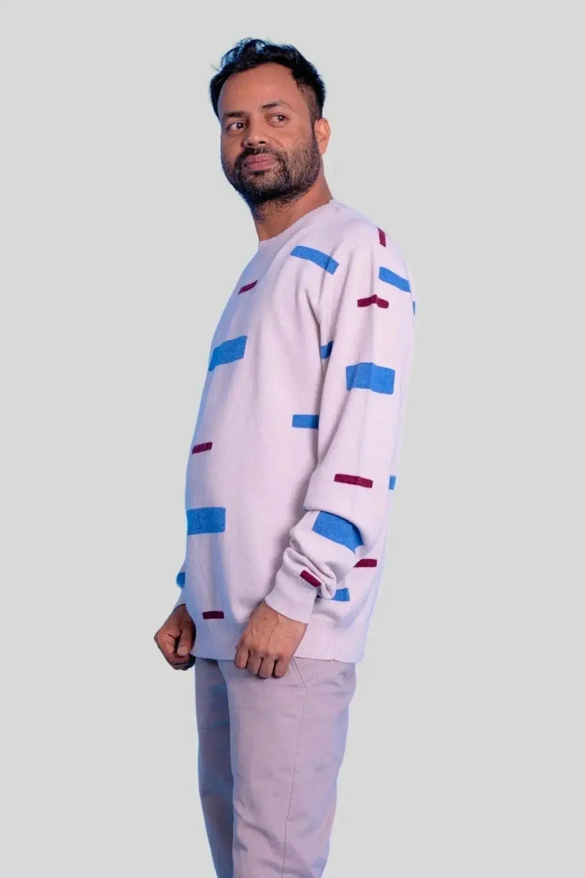 Man in white sweater and blue pants wearing Luxurious Italian Cashmere Crew Neck Sweater
