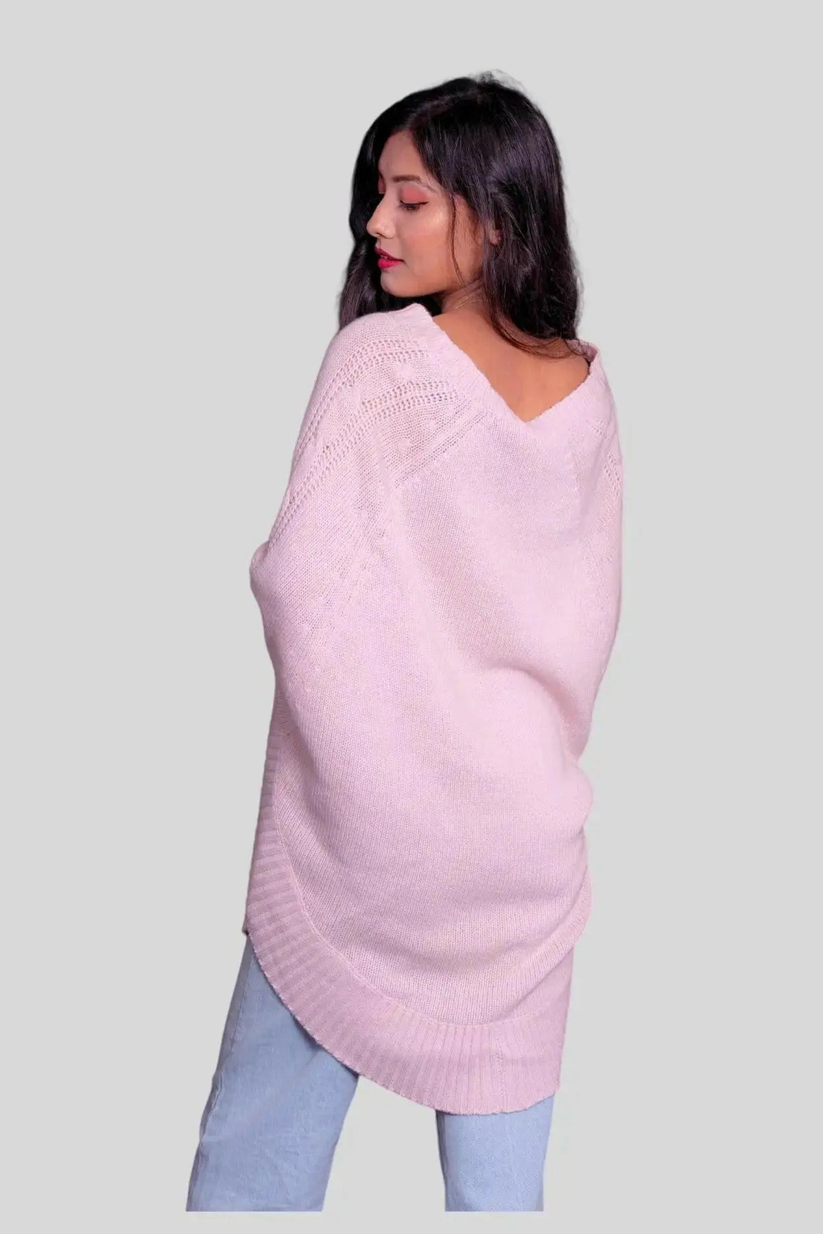 Pink oversized Italian cashmere poncho styled on a woman