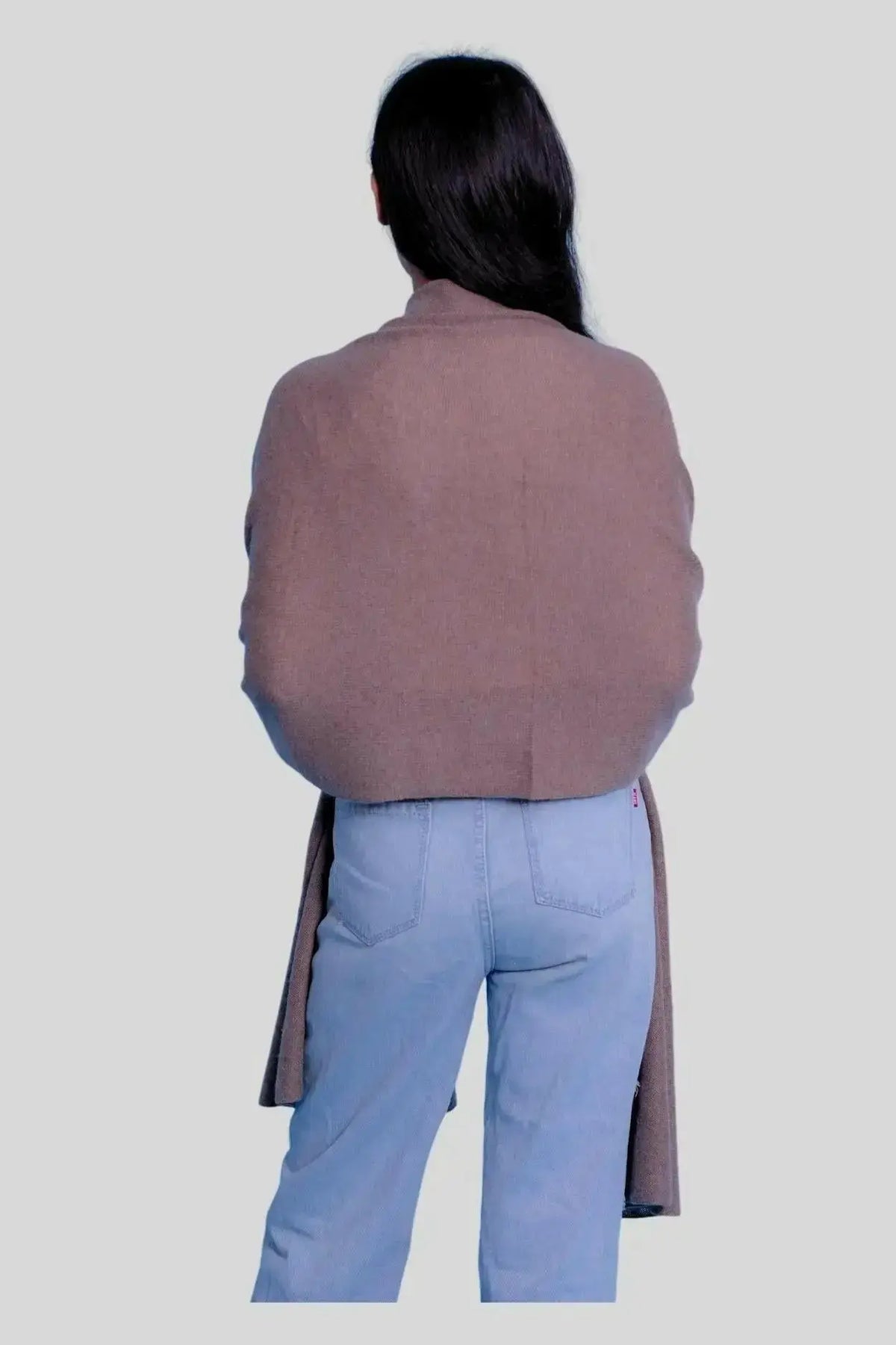Woman in brown coat and blue jeans wearing Luxurious Italian Cashmere Scarf for winter wardrobe
