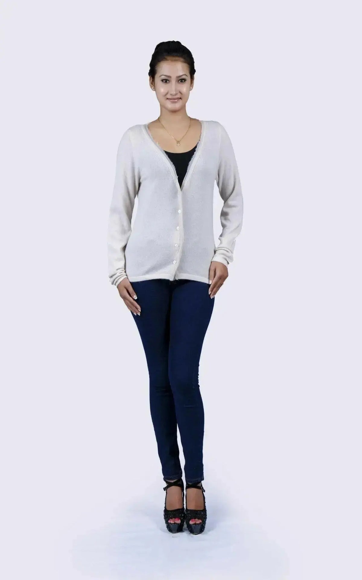 Woman in luxurious Italian cashmere V-neck sweater and jeans