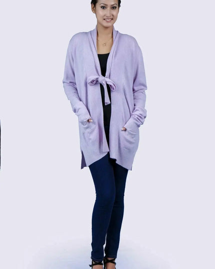 Woman wearing luxurious purple shawl collar pocket cardigan in jeans