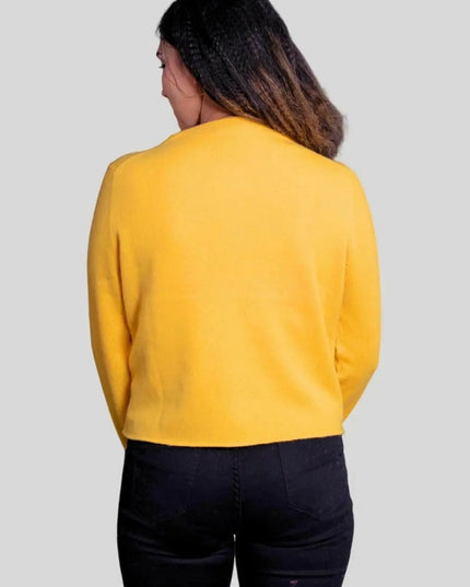 Woman wearing a yellow cashmere cardigan from Luxurious Women’s Cashmere Cardigan collection