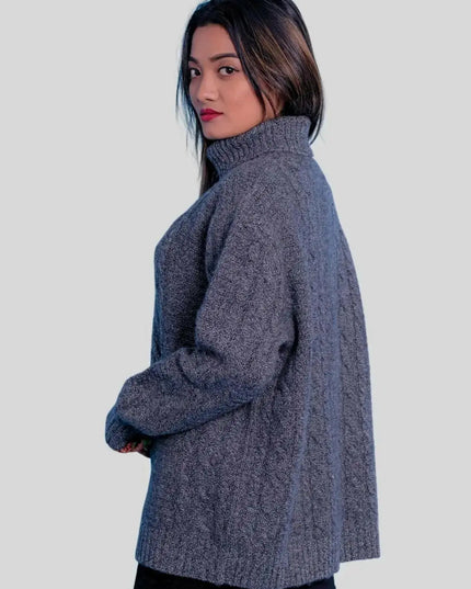 Luxuriously soft cashmere turtle neck sweater on woman in grey sweater and black pants