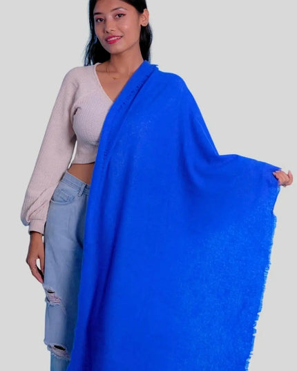 Woman holding blue cashmere felted scarf