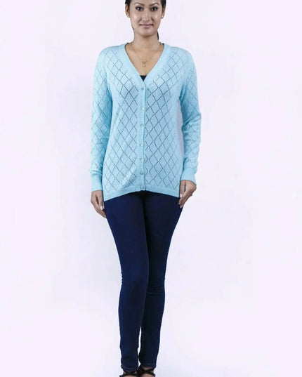Woman in blue sweater and jeans wearing Women’s Diamond Pointelle Cashmere Cardigan with V-neck design