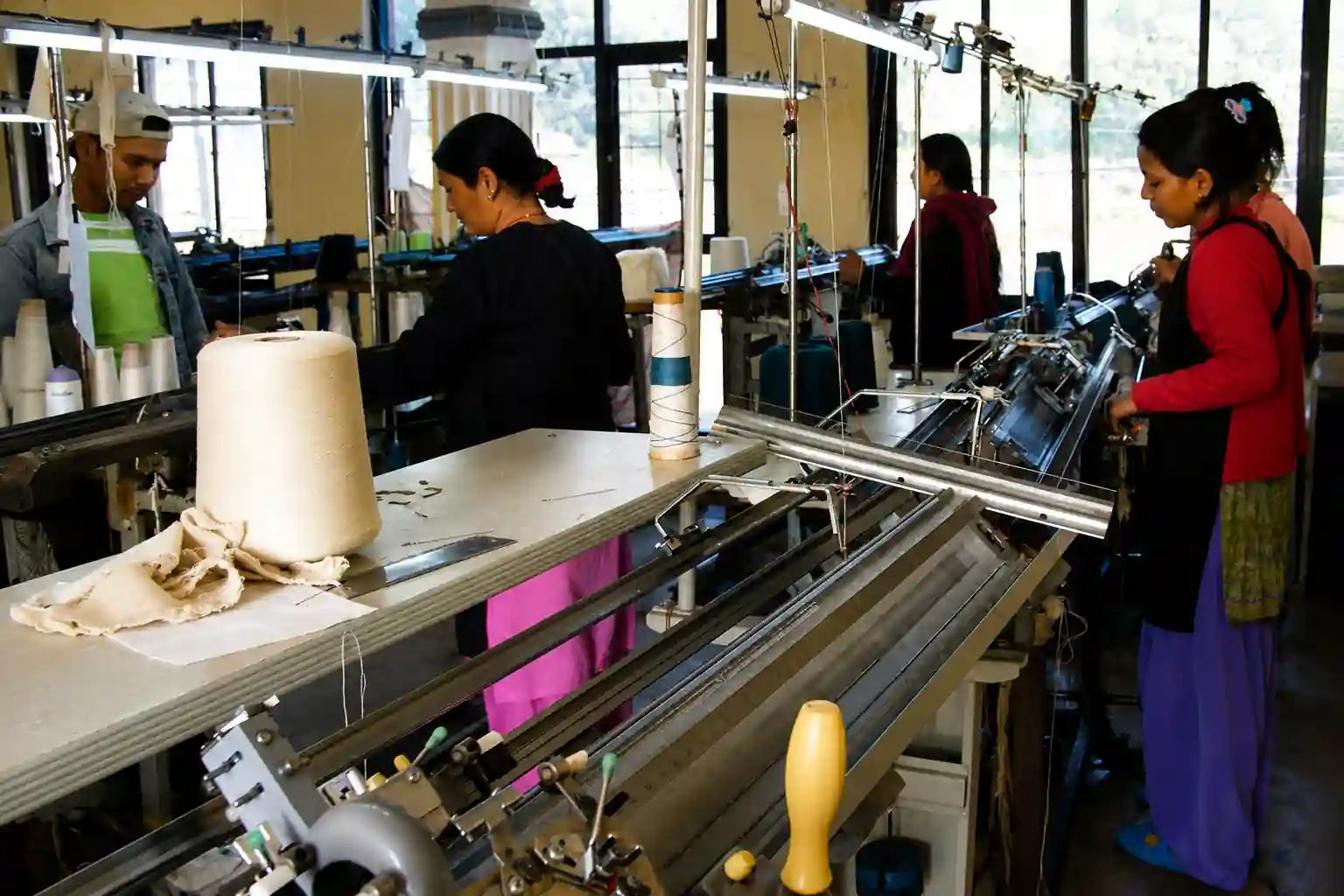 Nepali artisans working with cashmere knitwear in Kathmandu