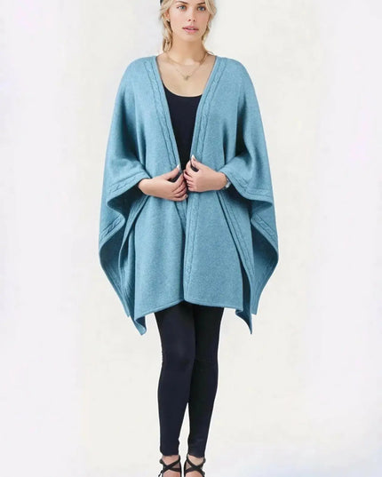 Woman wearing blue desert knit wrap ’KCI 142’ in front of white background