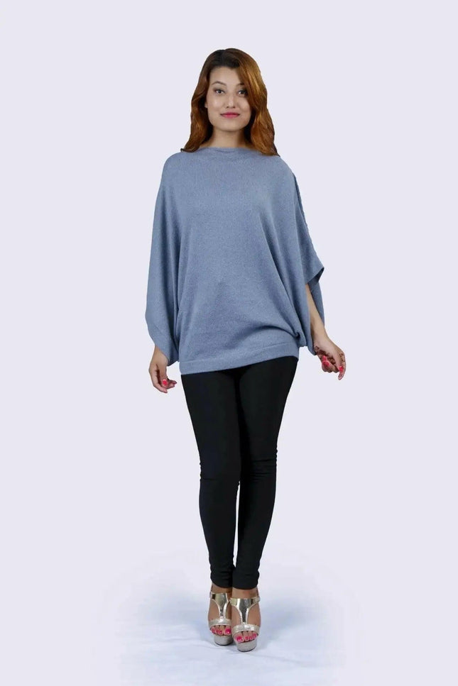 Cashmere Poncho | KCI 127 - Woman in blue sweater and black pants