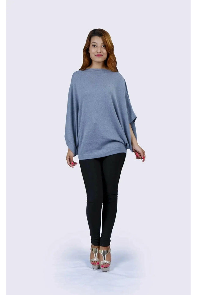 Cashmere Poncho | KCI 127 - Woman in blue sweater and black pants