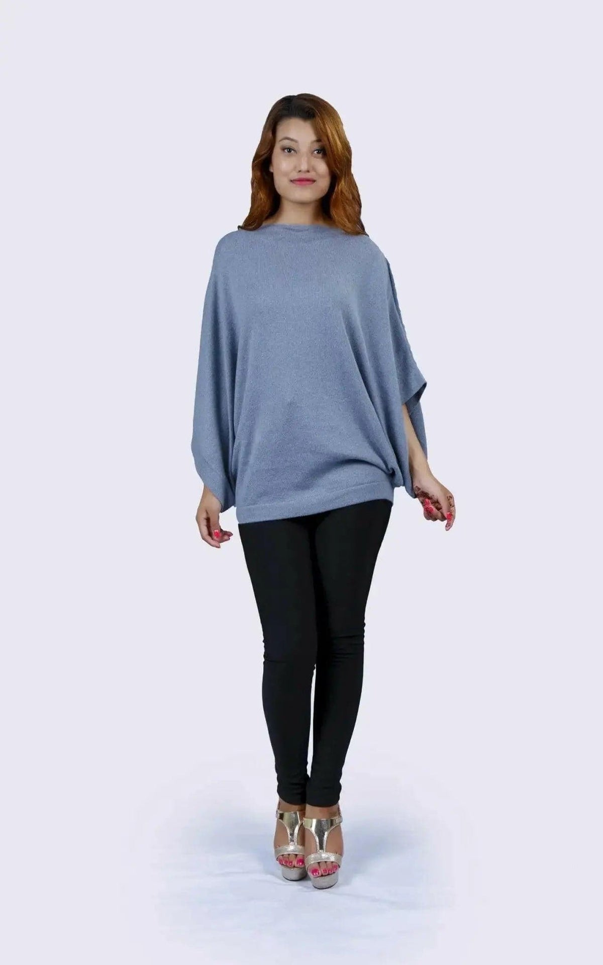 Cashmere Poncho | KCI 127 - Woman in blue sweater and black pants