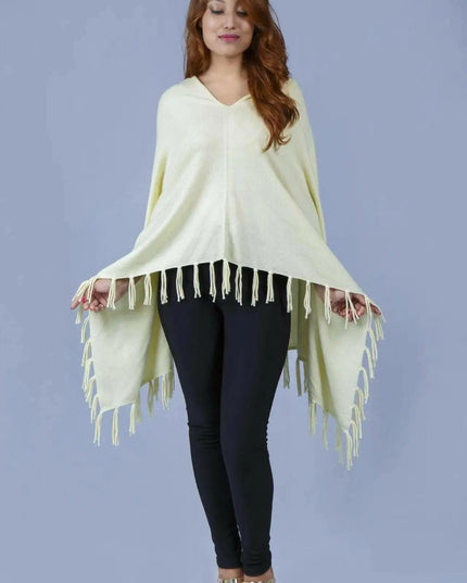 Woman wearing a yellow cashmere poncho with fringes - Kanchan Cashmere || KCI 249