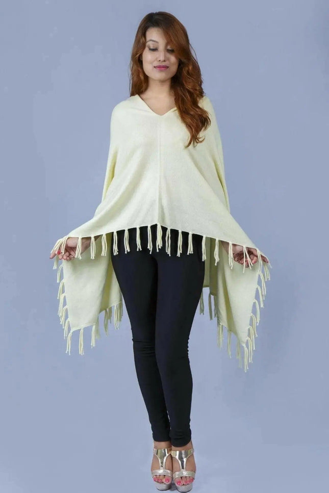 Woman wearing a yellow cashmere poncho with fringes - Kanchan Cashmere || KCI 249