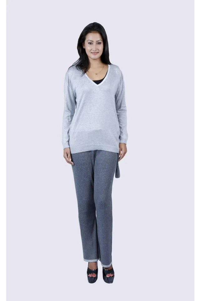 Woman in grey sweater and jeans – Cashmere Ribbed Trouser | KCI 109
