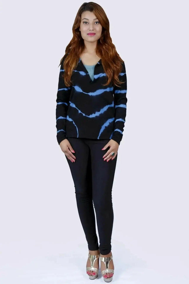 Woman wearing black sweater and jeans, showcasing Cashmere Sleeve Print Tunic Top