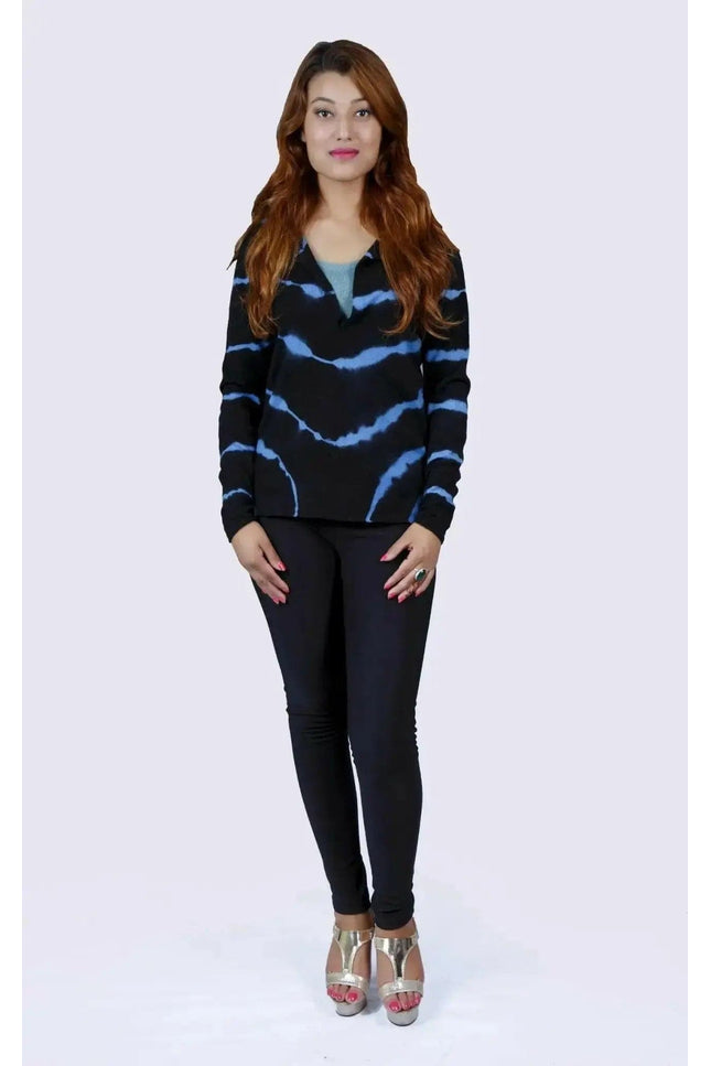 Woman wearing black sweater and jeans, showcasing Cashmere Sleeve Print Tunic Top