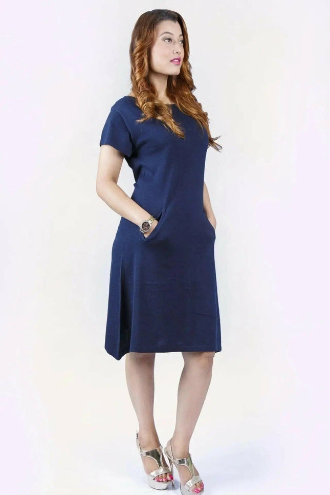 Woman in blue crew neck cashmere dress on white background