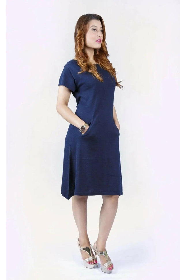 Woman in blue crew neck cashmere dress on white background