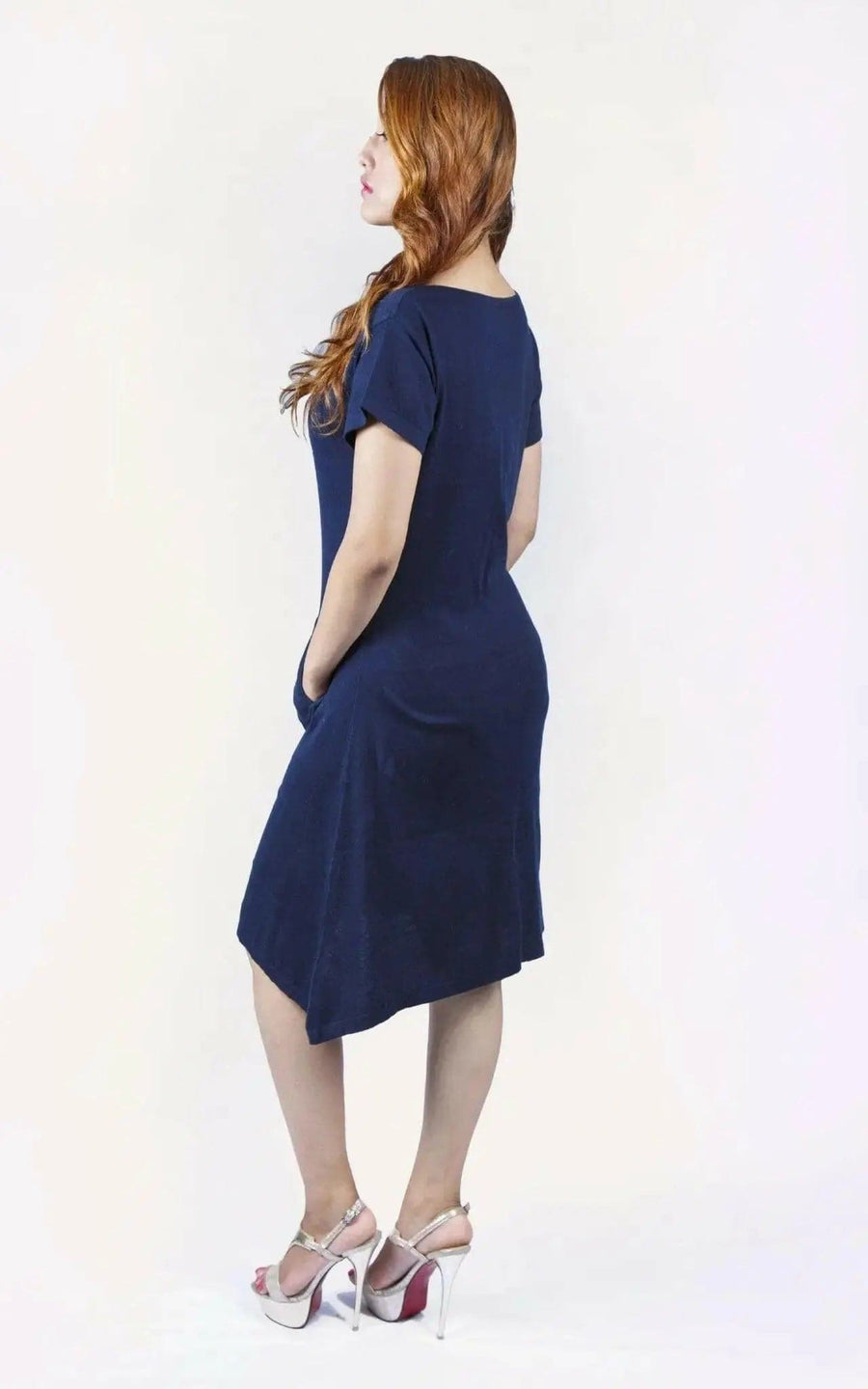 Woman in blue crew neck cashmere dress on white background