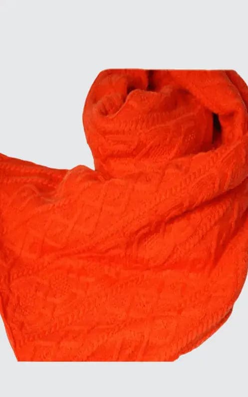 Italian cashmere scarf with intricate cable pattern in bright orange color