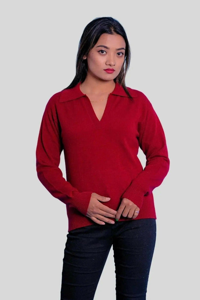 a woman in a red sweater standing next to a man 