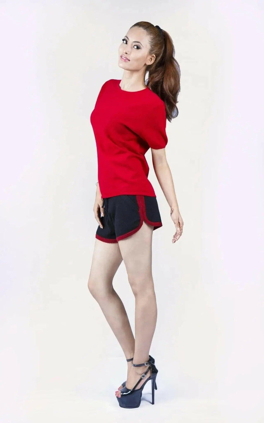 Italian Cashmere Turtle Neck T-Shirt with flattering turtle neck for women in red shirt and black shorts