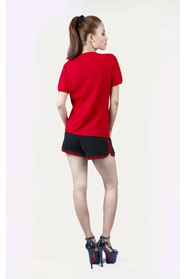 Italian Cashmere Turtle Neck T-Shirt with a flattering turtle neck worn by a woman in red shirt and black shorts