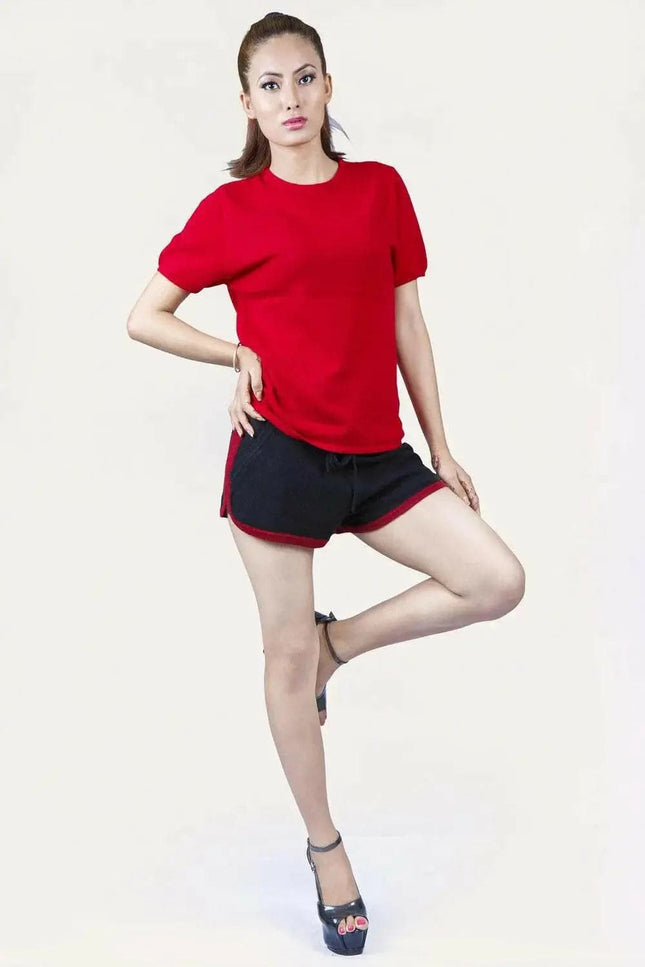 Italian Cashmere Turtle Neck T-Shirt featuring a woman in red shirt and black shorts