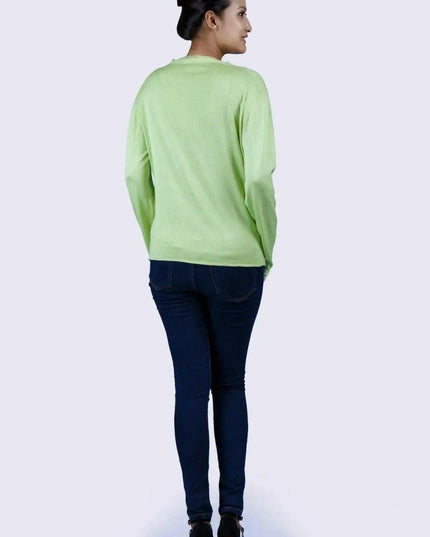 KCI 130 cashmere v neck sweater in green shown on woman in jeans
