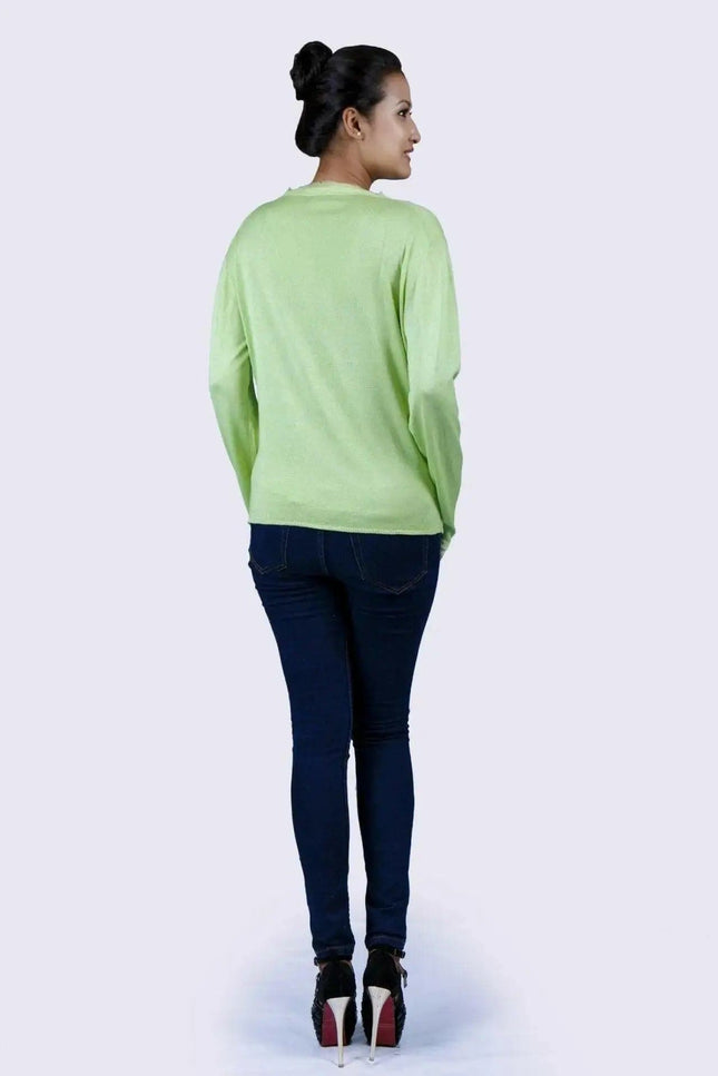 KCI 130 cashmere v neck sweater in green shown on woman in jeans