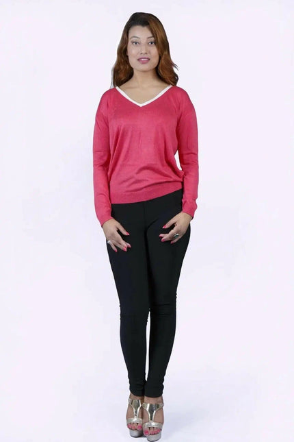 College knit KCI 135 in deep rose: woman in pink sweater and black pants