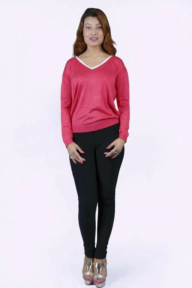 College knit KCI 135 in deep rose: woman in pink sweater and black pants