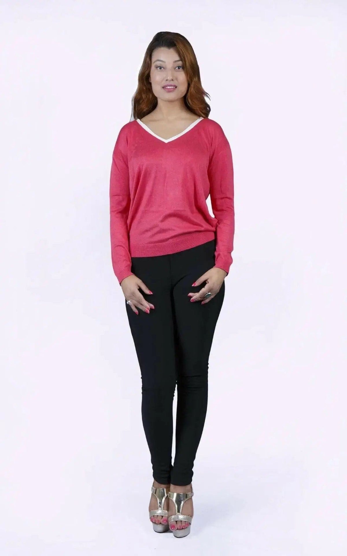 College knit KCI 135 in deep rose: woman in pink sweater and black pants