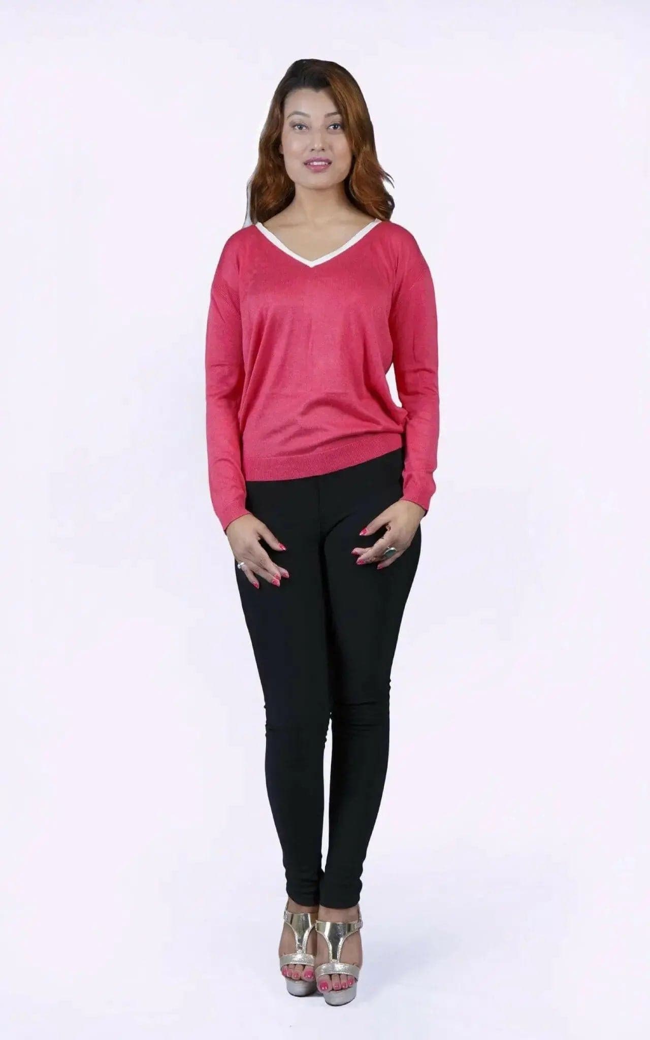 College knit KCI 135 in deep rose: woman in pink sweater and black pants
