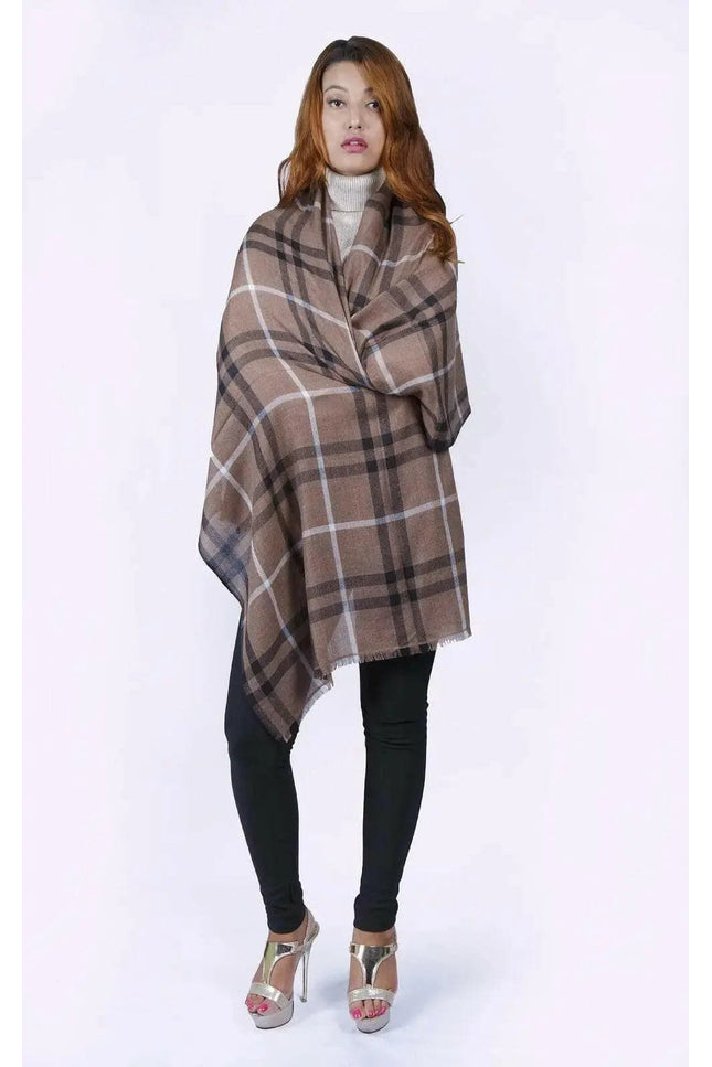 Woman in KCI 182 brown and black plaid poncho with raw trim