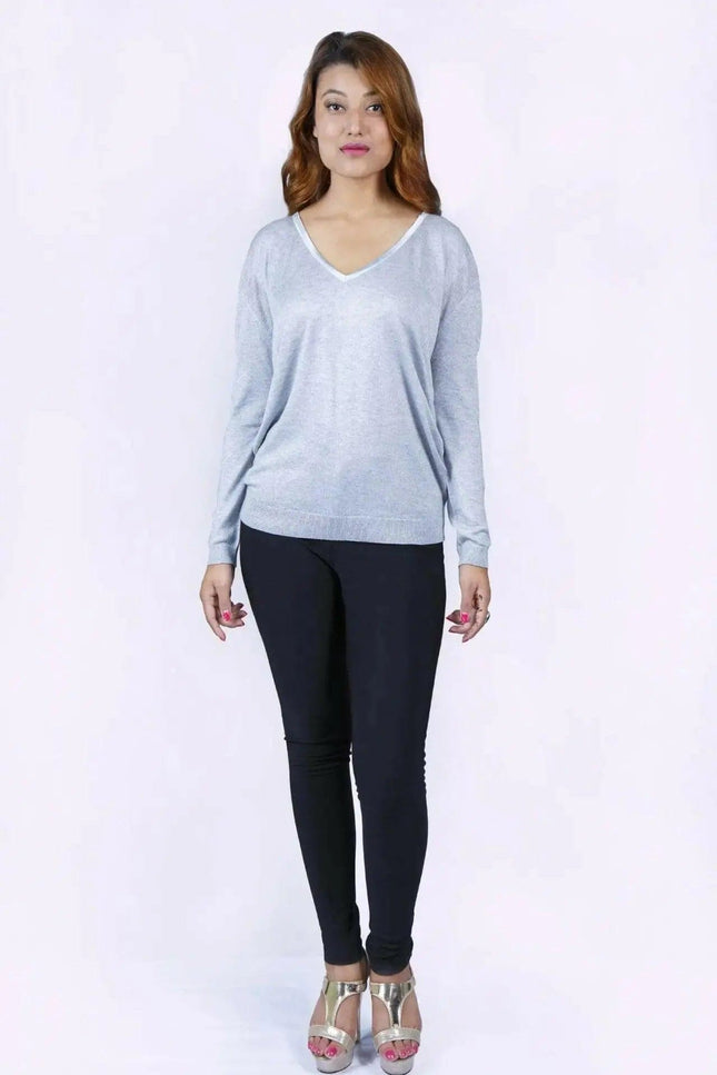 Woman in grey cropped sleeve jumper and black pants - KCI 226