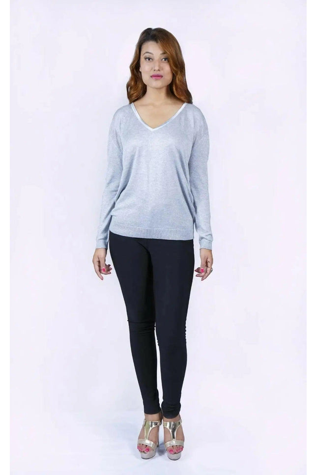 Woman in grey cropped sleeve jumper and black pants - KCI 226