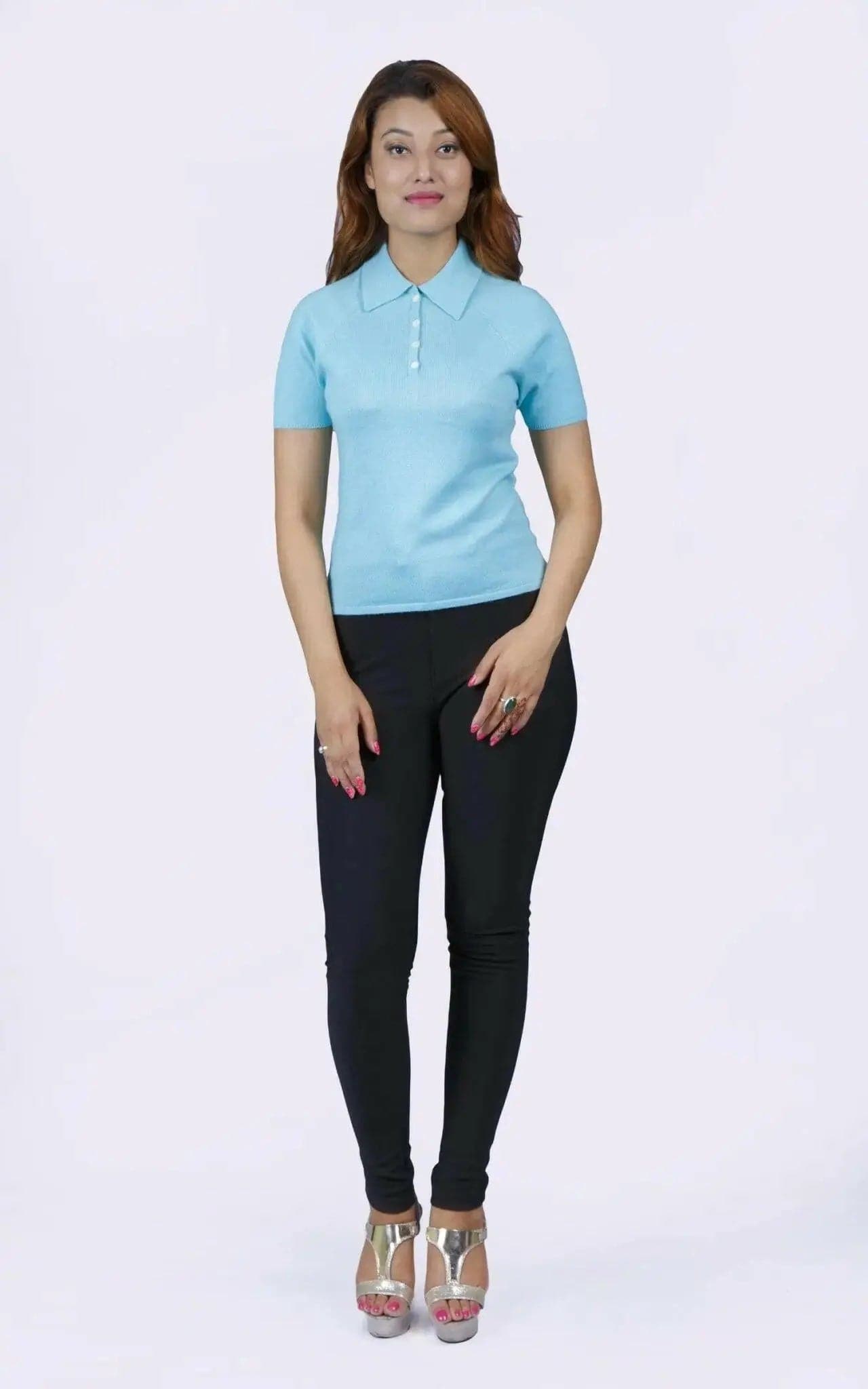 Woman in blue shirt and black pants, teal polo collar, KCI 232