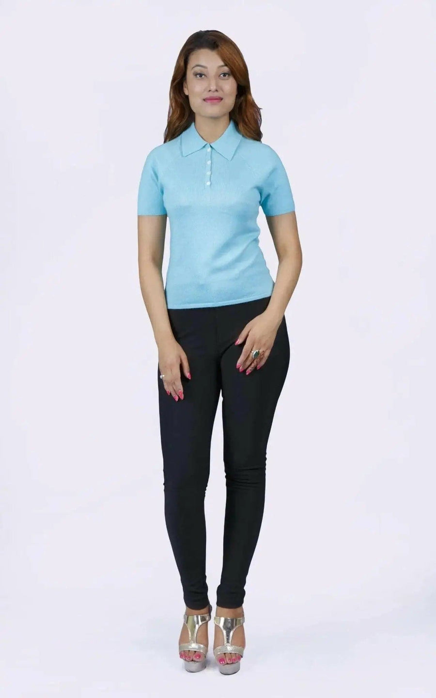 Woman in blue shirt and black pants, teal polo collar, KCI 232