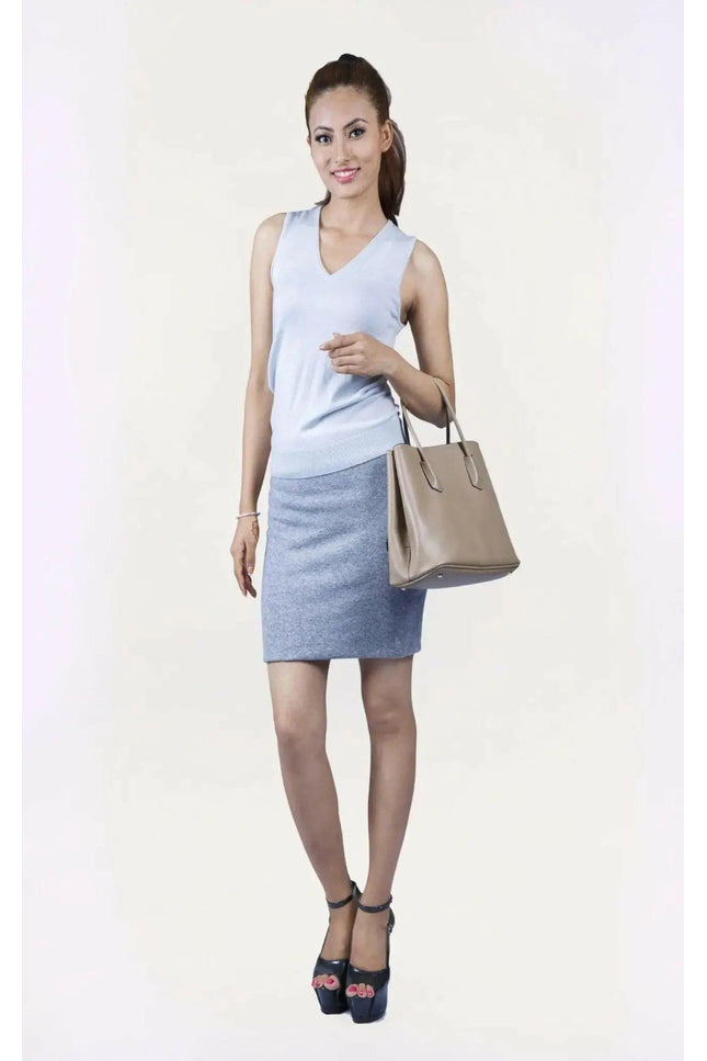 Woman in white top and blue skirt wearing KCI 233 cashmere skirt